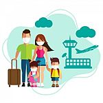 Family Tourism With Surgical Mask Face Protection At Airport Stock Photo
