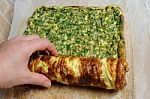 Fastening Omelette With Herbs In Roll Stock Photo