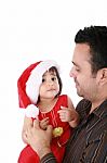 Father And Daughter Looking Happy Wearing Santa Christmas Hat Stock Photo
