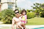 Father And Daughter Swimming Pool Stock Photo