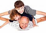Father Having Fun With Kids Stock Photo