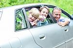 Father Out On A Long Drive With Kids Stock Photo