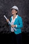 Female Architect And Project Plan Stock Photo