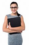 Female Assistant Holding Office File Stock Photo