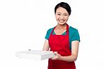 Female Chef Holding White Pizza Box Stock Photo