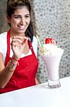 Female Chef Serving Strawberry Shake Stock Photo