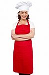 Female Chef With Arms Crossed Stock Photo