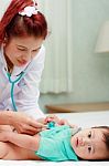 Female Doctor Checking Baby Petient Stock Photo