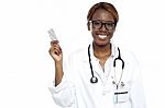 Female Doctor Holding Medicine Stock Photo