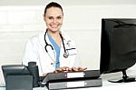 Female Doctor Typing On Keyboard Stock Photo