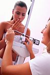 Female Doctor Weighing Patient Stock Photo