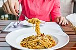Female Eating Spaghetti In Dining Stock Photo