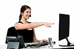 Female Executive Pointing At Computer Screen Stock Photo