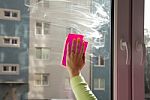 Female Hand Washing A Window Stock Photo