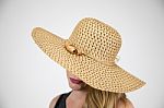 Female In Large Hat Hiding Face Stock Photo