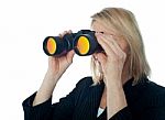 Female Looking Through Binocular Stock Photo