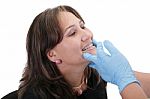 Female Patient Looking Treating At Her Dentist Stock Photo