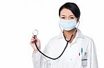 Female Physician Posing With Stethoscope Stock Photo