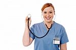 Female Physician Posing With Stethoscope Stock Photo