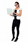 Female Secretary Using Laptop Stock Photo