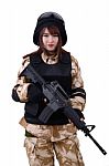 Female Soldier In Battle Uniform Holding Rifle Stock Photo