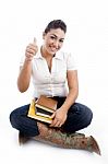 Female Student Showing Thump Up Stock Photo