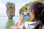 Female Traveler Shooting Natural View By Mobile Phone Stock Photo