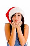 Female Wearing Christmas Hat And Giving You Flying Kiss Stock Photo