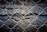 Fence And Grunge Wall Stock Photo