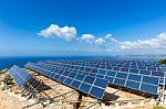 Field Of Solar Panels Or Collectors At Sea Stock Photo