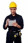 Field Worker Accessing Touch Pad Stock Photo