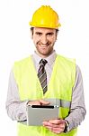 Field Worker Operating Touch Pad Device Stock Photo