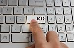 Finger Pressing Keyboard Key Written 2019 New Year On Laptop Stock Photo