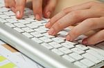 Fingers Typing On Keyboard In Close-up Stock Photo