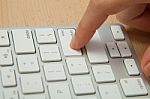 Fingers Typing On Keyboard In Close-up Stock Photo