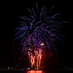 Firework Celebration From The Sea Shore Stock Photo