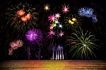 Firework Celebration From The Sea Shore Stock Photo