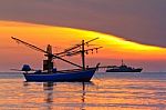 Fishing Boat At Sunrise Stock Photo
