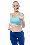 Fit Woman In Jogging Posture Stock Photo