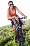 Fit Woman Riding Mountain Bike Stock Photo