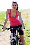Fit Woman Riding Mountain Bike Stock Photo
