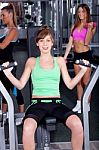 Fit Woman Working Out At Gym Stock Photo
