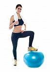 Fitness Lady Standing On Gym Ball Stock Photo