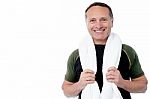 Fitness Trainer With Towel Around His Neck Stock Photo