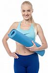 Fitness Woman With An Excercise Mat Stock Photo