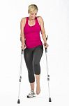 Fitness Woman With Crutches Stock Photo