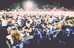 Food Festival Event With Blurred People Stock Photo