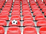 Football On Stadium Chairs Stock Photo