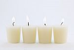 Four Candles Stock Photo