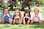 Four Teens With Hands On Their Chin Stock Photo